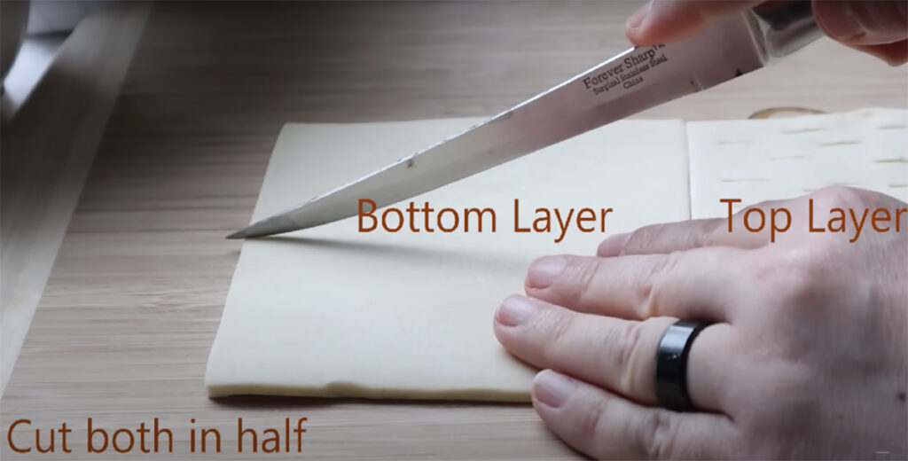 Nutella Walnut Puff Pastry Dessert puff pastry cut with a knife with written instructions of bottom layer, and top layer instructions.