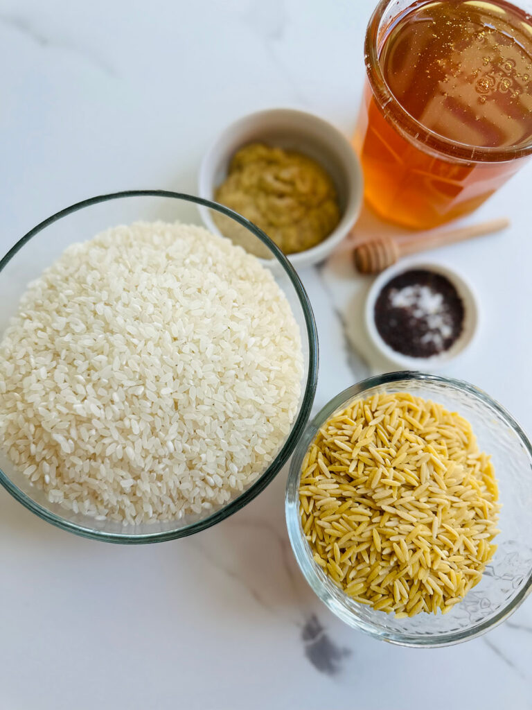Honey Mustard Chicken with Pinapple Salad w/ Orzo Rice - Rice and Orzo in glass bowls with mustand, mustard seeds with honey accenting photo.