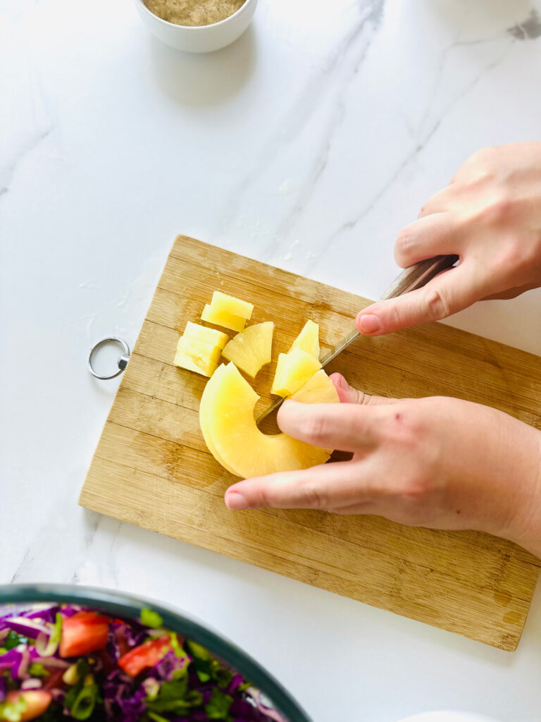 Honey Mustard Chicken with Pinapple Salad w/ Orzo Rice cutting pineapple
