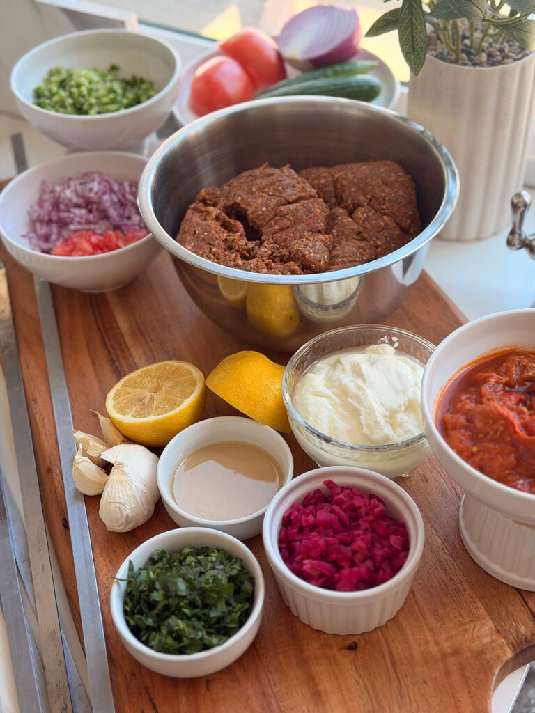 Kebob Crunch Bake - ingredients in bowlson a wooden chopping board.